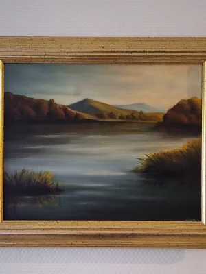 peinture à l'huile d'un paysage bucolique encadré dans un cadre or patiné